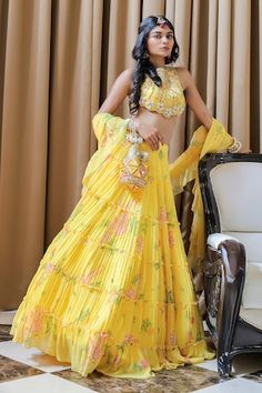 Yellow tiered lehenga with an attached cancan, pleated detailing and paisley print. Comes with a cowrie, shells, mirror and beaded embroidered padded blouse and a ruffled dupatta. - Aza Fashions Lehenga Pattern, Yellow Print, Paisley Print, Aza Fashion, Lehenga, Paisley, Types Of Sleeves, Destination Wedding, Yellow