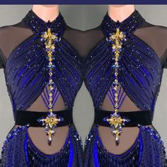 the back of a woman's dress with blue and gold beading on it