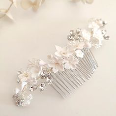 a close up of a comb with flowers on it