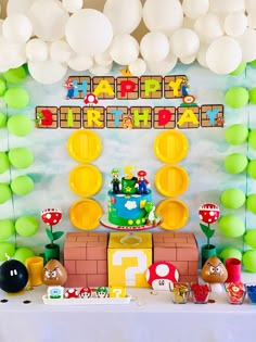 a mario birthday party with balloons and decorations