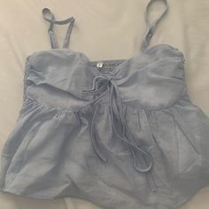 Size Small, I Would Say It Runs A Little Small So Maybe Xs New Without Tags! In Brand New Condition With No Rips Tears Or Stains. Gorgeous Baby Blue Color With A Baby Doll Silhouette. Adjustable Straps And Adorable Bow In The Front!! Baby Doll Top Outfit, Baby Doll Tops, Doll Silhouette, Babydoll Tank Top, Babydoll Shirt, Baby Doll Top, Babydoll Tank, Baby Blue Color, Baby Blue Colour