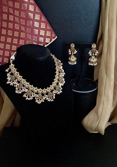 Beautiful Ethnic South Indian Temple Jewelry in Antique Gold Finish studded with colored American diamonds & cluster pearls all over. Jhumkis are paired with antique gold finish necklace. Perfect Guttapusalu to match with any longer necklace for heavier look. ✅Quality Guarantee   WHAT GOES IN  👉🏻High Quality Stones & Pearls. Brass based metal with Gold Platting & antique gold finish.  👉🏻Drawstring Closure.  👉🏻Total Necklace Length - 22-24" & adjustable  We want you to LOVE your new jewelry!  CARE TIP  1. Keep away from moisture and perfume 2. Store in cotton or zip lock bags or air tight boxes.  3. Spot cleaning only.  4. Jewellery is the last thing you should wear and the first thing you should remove.  Send us an email if you need help!  SHIPPING & TURNAROUND  We follow item dispat Guttapusalu Haram, South Indian Temple, Temple Necklace, Temple Jewelry, Indian Temple, Jewelry Antique, Wedding Jewellery Necklace, Temple Jewellery, American Diamond