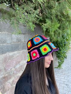 Granny Square Summer Hat has been carefully made for you with its stylish and eye-catching design. Warm and lively colored soft cotton threads are used. *It is one size fits all* Do not hesitate to contact me for bucket hats in the desired colors. *The color combination of this unique product is the same, but since the squares may vary, everyone will have a special product that is different from each other* Washing information It can be washed in the hand wash program at 36F / 30C. You can lay i Handmade Black Crochet Hat With Curved Brim, Handmade Black Mini Hat For Beach, Multicolor Crochet Hat For Festival, One Size, Multicolor Knitted Bucket Hat, Multicolor Hand Knitted Brimmed Hats, Black Crochet Wide Brim Hat, Multicolor Crochet Yarn Cap, Black Bohemian Crochet Hat, Multicolor Crochet Cap