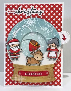 a christmas card with two little kids and a reindeer on the front, in red and white checkered paper