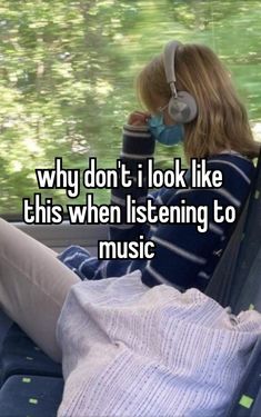 a woman sitting in the back seat of a car with headphones on