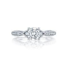 a diamond engagement ring on a white background