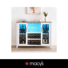 a white cabinet filled with lots of bottles