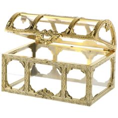 an ornately decorated glass box with gold trimmings on the bottom and sides