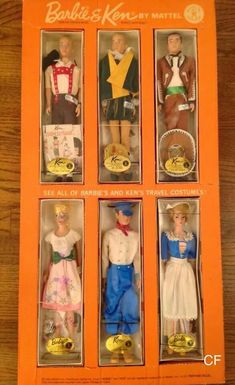 six dolls are in the same box as one is on the other, and two have different outfits