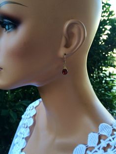 "Genuine Garnet earnings, burgundy gold dangles, dark red teardrop jewelry, January birthstone. Handcrafted with natural red Garnet Stones. Petite, minimalistic and lightweight. Real Untreated Garnet stones (8 x 6 mm) faceted teardrop shape gems wire wrapped and suspended on leverbacks. Length is about 1\" long. Each pair of gems is unique and one of a kind, they are untreated and natural stones, expect some imperfections. These beautiful earrings will be a nice gift for a female that like moder Formal Teardrop Wire Wrapped Earrings, Elegant Garnet Teardrop Earrings, Elegant Wire Wrapped Briolette Teardrop Earrings, Red Elegant Nickel-free Teardrop Earrings, Dainty Red Jewelry For Formal Occasions, Red Dainty Jewelry For Formal Occasions, Dainty Red Formal Jewelry, Elegant Handmade Drop Earrings As Gift, Elegant Handmade Drop Gift