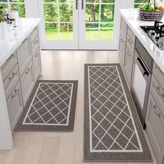 two rugs in the middle of a kitchen