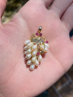 Total Weight: 7.1 grams Length: 34.2m (with bail) Width: 2.3cm Pearl: 6x3.4mm Ruby: 2.5mm Condition: In great condition showing little wear with no damage. All gold has been thoroughly checked with an Olympus XRF spectrometer. It is guaranteed 14k gold.  All our jewelry is properly washed and disinfected to ensure customers get clean items with every order.  Returns accepted but may be subjected to a restock fee.  Please message with any questions:) Heirloom White Jewelry With 17 Jewels, Fine Jewelry Yellow Gold Cluster Jewelry, White Gold Cluster Jewelry Stamped 14k, Heirloom Diamond Jewelry Pear Shaped, Heirloom Pear-shaped Diamond Jewelry, Elegant Multi-stone Pear-shaped Jewelry, Fine Jewelry In Yellow Gold With High Luster, High Luster Dangle Jewelry For Anniversary, Yellow Gold Fine Jewelry With High Luster