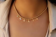 "name necklace A personalized gift for your loved one is why we create this trendy name necklace. 14k gold filled letters can spell out a name or word and hang on a stretchy elastic 3mm 14k gold filled or sterling silver beads chain. Letters measure approximately 1/4 of an inch in length. Also available sterling silver. CUSTOM LETTER NECKLACE This necklace can be customized with any letter of your choice. ✤ Please use the personalization box to let us know the initial that you would like. * DETA Silver Beaded Necklace, Necklace Packaging, Beads Chain, Gold Name Necklace, Monogram Necklace, Necklace Personalized, Letter Necklace, Sterling Silver Bead, Jewelry Gift Box