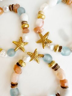 Gold Beaded Charm Bracelet For Beach, Handmade Bohemian Sand-colored Jewelry, Starfish-shaped Beaded Jewelry For The Beach, Beachy Sand-colored Jewelry For Gift, Beachy Sand-colored Jewelry Gift, Gold Hand Wrapped Jewelry For The Beach, Bohemian Style Bracelet With Starfish Charm, Beach Gold Hand Wrapped Jewelry, Vacation Bracelet With Starfish Charm