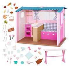 a doll house with pink furniture and accessories