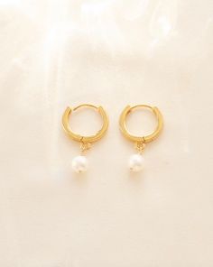 14k Gold Filled Hoop Earrings, Gold Pearl Hoop Earrings, Bridesmaid Gift, Small Pearl Hoops, Gift For Wife, Gold Tiny Hoops, Mini Hoops2 favorites blended together, huggies and pearls! Versatile for a night out or a cozy night in. These pearl huggies are definitely on-trend. -- made to order -- Details: Gold fill or sterling silver. Freshwater pearl measuring 6mm. Handmade to order in our Santa Rosa Studio. Please allow for natural variations to occur. Gift Pearl Charm Huggie Hoop Earrings, Gift Hoop Huggie Earrings With Pearl Charm, Small Hoop Earrings With Pearl Charm For Gift, Small Hoop Earrings With Pearl Charm As Gift, Gift Small Hoop Earrings With Pearl Charm, Small Hoop Hypoallergenic Earrings For Wedding, Hypoallergenic Small Hoop Earrings For Wedding, Wedding Huggie Hoop Earrings With Pearl Charm, Pearl Huggies