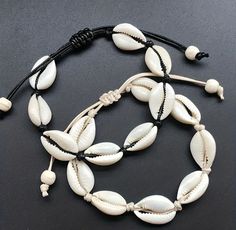 Looking for a stylish and distinctive shell conch bracelet? Try our Bohemian shell conch bracelet instead! The elegance of beach-inspired jewellery is combined with the charm of Boho style in this handcrafted masterpiece. This elaborately braided design created by the pearls and shells evokes the serenity of ocean waves and the spirit of summer.  This bracelet epitomizes unisex style and coastal charm, whether strolling down the beach or adding a touch of beachy beauty to your everyday outfit. W Seashell Bracelet, Knit Bracelet, Rope Jewelry, Pola Gelang, Bohemian Accessories, Shell Bracelet, Foot Jewelry, Cowrie Shell, Shell Jewelry