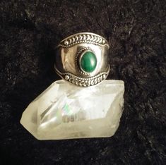 "Shield Maiden *MALACHITE* Sterling Ring Size 10 Listing is for ONE ring. Last photo shows other beautiful items available. Stamped \"STERLING\" and maker's mark symbol inside of band. Ring has an aged patina and lovely intricate scrollwork details on wide shield setting. Light wear on band as shown in photos.  Otherwise, ring is in excellent condition. Genuine MALACHITE gemstone measures approx 6mm wide by 8mm long. Cabochon oval bezel set stone. Please be aware not to soak or submerge in chemical cleaners which might loosen settings or damage stone. Comes gift boxed. ** Please note** As these are natural gemstones, some variations will occur. Also check out my  FaCeTeD Hematite Band Rings as shown in last photo :) https://www.etsy.com/shop/AuntVestas/search?search_query=FaCeTeD+hematite& Handmade Adjustable Spiritual Emerald Ring, Mystical Green Rings Perfect For Gifts, Handmade Emerald Spiritual Rings, Handmade Spiritual Emerald Ring, Green Spiritual Ring For Collectors, Green Spiritual Collectible Rings, Spiritual Green Rings For Collectors, Shield Maiden, Ring Size 10