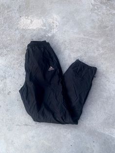 Vintage 2000s Adidas Black Track Pants - Size M - Outseam 40", Inseam 30" Waist 14" across - Message for more information Please take note of the measurements listed as these are vintage clothes and may fit different than the tag size. Follow our page for more vintage clothing drops! DISCLAIMER: All items are vintage so please be mindful that if by chance there is a flaw on the item we simply may have just missed it. Inquire for more product information. Black Y2k Parachute Trousers, Black Full Length Y2k Bottoms, Black Y2k Style Trousers, Y2k Black Cargo Trousers, Black Y2k Cargo Trousers, 90s Style Full-length Streetwear Pants, 90s Full Length Streetwear Pants, 90s Parachute Pants For Streetwear, 90s Full-length Streetwear Bottoms