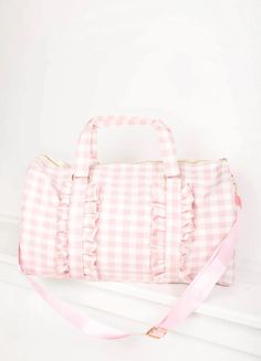 Gingham Ruffle Duffle Bag with Patches. Personalized. 0-2 patches included. An easy choice for a weekender bag, our Ruffle Duffle comfortably holds all of your getaway essentials--like packing cubes, a sweatshirt & Pouches--while still fitting under the seat of airplanes. Perfect to use as a gym bag, travel bag, overnight bag, baby bag, overnight bag for kids, daycare bag and more. Bag With Patches, Daycare Bag, Letter Patches, Holdall Bag, Kids Daycare, Outfits Petite, Sac Week End, Current Fashion, 2022 Trends