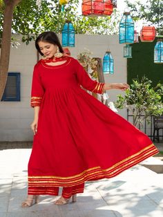 Royal Solid Red Round Neck Anarkali Waist Gathered Kurta Paired with Red Plazzo and Chanderi Dupatta Golden Work on it. Neck: Round Neck Sleeve Length: 3/4th Kurta Length: Ankle Length Work Type: Gota Patti Fabric: Kurta & Botton - Cotton Dupatta - Banarasi Chanderi Note: Dry Clean Only. The product will be shipped within 15-20 days of the order placed Measurements: Size Bust Waist Hip XS 34 28 36 Size 36 30 38 M 38 32 40 L 40 34 42 XL 42 36 44 2XL 44 38 46 3XL 46 40 48 4XL 48 42 50 5XL 50 44 52 Round Neck Anarkali, Chanderi Anarkali, Chanderi Dupatta, Red Kurta, Red Flare, Cotton Dupatta, Online Shopping India, Solid Red, Royal Red