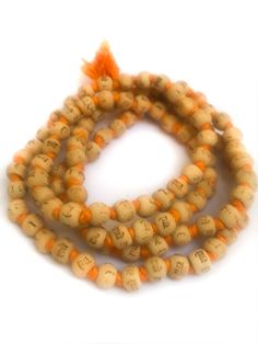 Neem japa mala made from Neem beads, hand knotted on orange cotton thread, and printed in Hindi script with "Radhe Radhe" on each bead. (Printing is not so great; barely legible in some cases, but the thought is there!) The beads are approximately 8mm or 10mm (two sizes) and end with small orange-colored cotton tassel. Choose from two sizes small 7- 8mm beads ($4.50) large 9 - 10mm ($5.50) Hindi Script, 8mm Beads, Radhe Radhe, Beauty Clothes, Unique Handmade Jewelry, Cotton Thread, White Cotton, Hand Knotted, Hand Carved