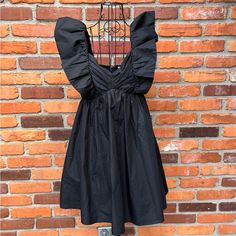 Adorn Yourself With This Ruffle Sleeve Mini Dress! Crafted With Lightweight Material And Featuring Ruched Detailing At The Bust, Smocking At The Back And Discreet Side Pockets, This Dress Is As Stylish As It Is Comfortable. The Perfect Way To Feel Cute And Flirty, You'll Be Sure To Make A Statement In This Charming Black Mini! Never Worn! Brand: Sunland17 Style: Ruffled Strapped Mini Dress Size: Small Color: Closure: Front Zipper Lined: Yes Condition: New Without Tags Flaws: None Material: See T Black Ruffled Dress For Summer, Black Summer Dress With Ruffles, Black A-line Dress With Ruffles, Black Ruffle Sleeve Party Dress, Black Mini Dress With Ruffle Hem And Sleeves, Black Dress With Ruffled Straps For Night Out, Spring Mini Dress With Ruffle Sleeves For Night Out, Black Ruffle Sleeve Dress For Night Out, Black Summer Mini Dress With Ruffle Hem