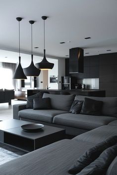 a living room filled with lots of furniture next to a kitchen and dining room table