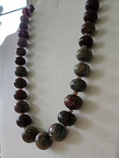 Hand-painted beads from Nigeria. Blue and brown Hand made Necklace. If you have any questions, comments, or concerns please feel free to reach out! Brown Beaded Necklaces With Oval Beads, Brown Beaded Necklace With Colorful Oval Beads, Brown Beaded Necklace With Oval Beads, Brown Necklaces With Colorful Oval Beads, Bohemian Brown Beaded Necklaces With Oval Beads, Brown Necklaces With Polished Oval Beads, Brown Polished Beads For Jewelry Making, Unique Brown Polished Beads, Unique Brown Necklaces With Colorful Beads