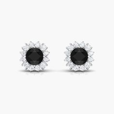 Product Details A Celebration without Gift is Incomplete, a Gift of Jewelry will bring smiles of delight on Mothers Day. Explore these Stud Earrings adorned with Round Cut Black Diamond in Prong Setting with Halo Moissanite, crafted in Solid Gold Metal. Product Information SKU SHP-EARRINGS0621110317 Length 6.8 mm Width 6.8 mm Height 4 mm Weight 1.68 gm (Approximate) BLACK DIAMOND INFORMATION No.of Stones 2 Pieces Total Weight 1.20 Carat (Approximate) Dimension(approx) Round-5X5 mm-2 Pcs Color Bl Rose Gold Black Diamond, Black Diamond Earrings Studs, Black Diamond Studs, Black Diamond Earrings, Halo Stud Earrings, Halo Earrings Studs, Classic Earrings, Black Onyx Stone, Signature Jewelry