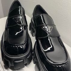 100% Authentic U.S. Size: 10 Prada Size: 9 Color: Nero Brand New Never Worn. Small Scuff In The Sole Of The Loafers (Came From Prada That Way). Includes: Box, Dust Bags, And Certificates Of Authenticity Luxury Loafers With Vibram Sole And Round Toe, Black Business Platform Loafers With Vibram Sole, Black Vibram Sole Platform Loafers For Business, Office Platform Loafers With Textured Sole, Black Loafers With Vibram Sole For Office, Luxury Black Patent Leather Platform Loafers, Black Office Loafers With Vibram Sole, Luxury Black Loafers For Business Casual, Black Luxury Loafers For Business Casual