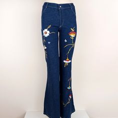 "Hand painted Bell Bottomed Jeans by Lost Ginger Every piece is painted by hand, with its own special, unique design and no two items are exactly the same.  Each design is painted with indelible water resistant textile paints. Flowers have been used over centuries to symbolize meanings and convey messages. In nature, each flower has its own special meaning whether expressed as a bouquet or an art form. Offer a gift with a hand painted flower to say with grace, \"I appreciate you. Thank you.\" For perfect fit you can see the detailed dimensions below: Size: US : 8 - 10 Waist: 30 inches / 76 cm All dimensions measured in unstretched state. Machine wash at low temperatures (up to 30 C), do not iron the image, do not machine dry, do not bleach. Visit our shop to find more hand painted clothes. Boot Leg Pants, Jeans Flowers, Blue Boots, Painted Flower, Painted Clothes, Art Handmade, Denim Pants, Floral Art, Bell Bottom Jeans