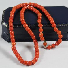 -Antique 9k Gold Natural Orange Red Coral Necklace -Total length: 16 in -Biggest bead size:5.75 mm x 5.65 mm -Smallest bead size: 4.25 mm x 5.4 mm -Total weight: 19.7 g -Not perfectly round Classic Red Hallmarked Necklace, Classic Necklace With Spacer Beads For Gift, Classic Red Beaded Jewelry, Classic Orange Necklaces For Formal Occasions, Classic Orange Necklace For Formal Occasions, Orange Classic Formal Necklaces, Orange Classic Formal Necklace, Classic Red Gemstone Beads Necklace, Classic Red Necklace With Gemstone Beads