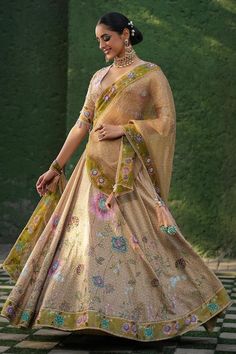 Yellow lehenga with an attached cancan, all-over floral prints, highlighted with pearls, glass beads and sequin embroidery. Comes with coordinating blouse and dupatta. - Aza Fashions Meenakari Embroidered Fabric For Reception And Navratri, Meenakari Embroidered Anarkali Fabric For Reception, Anarkali Lehenga With Multicolor Embroidery And Meenakari, Anarkali Embroidered Fabric With Meenakari For Reception, Silk Lehenga With Meenakari For Designer Wear, Anarkali Lehenga With Meenakari Embroidery, Silk Meenakari Choli For Reception, Traditional Meenakari Embroidered Lehenga, Bollywood Silk Lehenga With Meenakari Detail