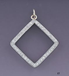 Presented is a gorgeous 14 karat white gold and diamond pendant. This piece is of relatively modern make, likely made in America. The pendant is done in an open square or diamond shape, bead set with 44 single cut diamonds. The diamonds are SI-2 to I-1 clarity and H color. The total diamond weight is about 44 points, or slightly shy of half a carat. The pendant is in excellent condition. The diamonds are all intact . The pendant is not stamped or hallmarked but we have tested it with nitric acid White Gold Square Diamond Jewelry, Square White Gold Diamond Jewelry, Square Diamond Cut Jewelry, Silver Jewelry With Single Diamond Square Pendant, Silver Jewelry With Single Diamond In Square Pendant, Silver Diamond Necklace With Square Pendant, Diamond White Rectangular Jewelry With Pave Setting, Diamond White Square Pendant Jewelry, Square Diamond Jewelry For Anniversary