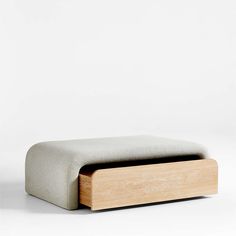 a wooden bench sitting on top of a white floor