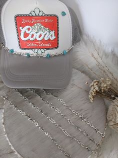 Cowboy Barbed Wire Trucker Hat Charm Bands. Customize your favorite Trucker Hat with a chain band!  Pick the perfect one for your hat!  Easy to apply- These just clip onto the mesh part of your trucker hat with lobster claws on both ends!   Silver barbed wire trucker hat chain or Silver barbed wire with turquoise stone accents. Want to customize A chain-- we can do that!! Message me to make your very own customized charm chain!   This listing is for one custom charm chain, hat not included. NOTICE OF NON-AFFILIATION AND DISCLAIMER: We are not affiliated, associated, authorized, endorsed by, or in any way officially connected with the brand shown or any of its subsidiaries or its affiliates. All related names, marks, emblems and images are registered trademarks of their respective owners. T Trendy Adjustable Hats With Chain Detail, Trendy Adjustable Hat With Chain Detail, Trendy Adjustable Hat With Chain, Adjustable Chain Necklace For Festivals, Adjustable Chain Strap Jewelry For Festivals, Adjustable Silver Chain Necklace, Adjustable Silver Hat Bands For Festivals, Adjustable Silver Hat As Gift, Adjustable Silver Beach Hat