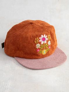 Cap off your look with this super cool and easy corduroy snapback! With color contrast on the bill and the adjustable strap on the back, this hat brings a fun, vibrant addition to any outfit. The cute embroidered designs on the front add a touch of personality, while the unstructured style gives it a relaxed and laid-b Cool Hat Designs, Granola Fits, Granola Outfits, Embroidery Hats, Folk Flowers, Masc Fashion, Folk Floral, Embroidered Designs, Hat Hair