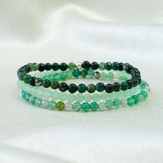 Green Beaded Bracelet Set, Crystal Healing Beaded Bracelets for Women, Spiritual Protection Gift, Stretch Stacking Bracelet, Gift for Her ❗Adult bracelet length recommended to choose from 6.5'' This triple-layered bracelet set features natural green stone beads in varying shades, showcasing the beauty and harmony of nature while offering profound healing properties and spiritual protection. Each bracelet is crafted with high-quality natural green gemstones, designed to bring balance and protecti Elegant Green Round Beads Friendship Bracelets, Adjustable Green Crystal Bracelet With 108 Beads, Green Stackable Beaded Bracelets With Round Beads, Women Spiritual, Aura Protection, Green Beaded Bracelets, Layered Bracelet, Spiritual Protection, Crystal Healing Bracelets