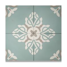 a blue and white tile with an intricate design on the bottom half, in different colors