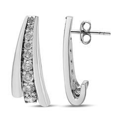 Brilliant round diamonds in prong setting subtly graduate in size from smallest at the top to largest at the bottom to create these sparkling huggie earrings for her. Embraced on both sides by polished .924 sterling silver, these diamonds nestle in prong settings, sweeping downward from the ear. The total 1/2 cttw round diamonds are of an approximate I2-I3 Clarity and I-J Color to fascinate with their endless sparkle. The push back findings keep these pierced earrings safe and secure on your ear Sterling Silver Huggie Earrings With Brilliant Cut Diamonds, Dazzling Brilliant Cut Silver Huggie Earrings, Diamond White Brilliant Cut Cubic Zirconia Huggie Earrings, Dazzling Prong-set Huggie Earrings For Anniversary, White Gold Huggie Earrings With Baguette-cut Cubic Zirconia, Diamond Huggie Earrings, Fine Ring, Bridal Bands, Huggie Earrings