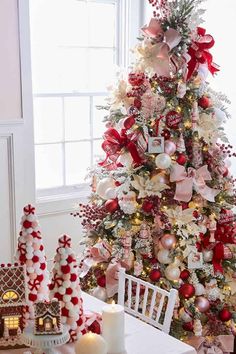 a christmas tree decorated with red and white ornaments