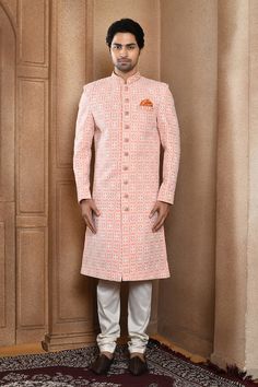 Peach sherwani with all over resham jaal embroidery. Paired with a off white churidar. - Aza Fashions Orange Zari Work Sherwani For Wedding, Orange Sherwani With Zari Work For Wedding, Orange Wedding Sherwani With Zari Work, Wedding Orange Sherwani With Zari Work, Orange Sherwani For Wedding Eid Festival, Orange Sherwani For Wedding And Eid, Orange Sherwani For Wedding At Eid, Fitted Traditional Wear With Meenakari For Reception, Designer Pink Sherwani With Pallu Detail