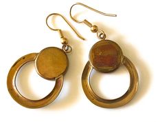 "This is a stunning pair of vintage hand crafted Abalone and brass Modernist circle earrings by local artist Steven Battelle. These earrings are exceptionally beautiful with a rich patina to the brass. A Modern yet organic design that will compliment any outfit... You will be certain to get many compliments! *Steven Battelle has followed a singular, somewhat circuitous route to his current incarnation as a designer of unique treasures of wearable art. Diverging from an early interest in painting Antique Gold Brass Jewelry, Antique Gold Round Brass Jewelry, Vintage Brass Hoop Earrings For Gifts, Handmade Metal Retro Earrings, Handmade Retro Metal Earrings, Nickel-free Bronze Circular Jewelry, Nickel Free Circle Bronze Jewelry, Gold Brass Earrings With Brass Hardware, Vintage Round Brass Jewelry