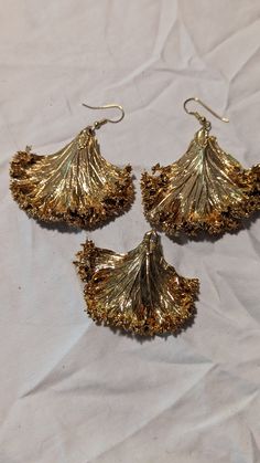 Gold plated leaf dangle earrings and pendant set. Leaf-shaped Metal Jewelry For Party, Festive Costume Jewelry Dangle Earrings, Gold Leaf-shaped Earrings For Party, Gold Leaf-shaped Jewelry For Jewelry Making, Gold Leaf Shaped Metal Jewelry, Elegant Brass Leaf Jewelry, Elegant Leaf-shaped Jewelry For Party, Leaf-shaped Metal Party Jewelry, Elegant Leaf-shaped Party Jewelry