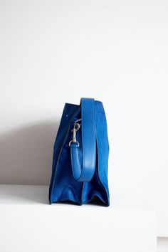 Royal Blue Phoebe Philo era ponyhair shoulder bag with toggle closure. Two main compartments with zip closure middle compartment and four side pockets Phoebe Philo Celine Bags, Luxury Blue Bucket Bag With Double Handle, Blue Top Handle Bag With Leather Handles, Luxury Blue Top Handle Hobo Bag, Luxury Blue Hobo Bag With Top Handle, Blue Top Handle Hobo Bag With Detachable Handle, Blue Top Handle Bucket Bag For Daily Use, Everyday Double Handle Bucket Bag With Palladium Hardware, Blue Leather Handles Double Handle Bucket Bag