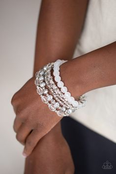 Infused with silver accents, a glassy collection of white and metallic crystal-like beads are threaded along stretchy bands around the wrist for a whimsically layered look. Sold as one set of six bracelets. p9wh-wtxx-206xx RELEASED 12 MAR 20 Paparazzi Accessories Jewelry, Bracelet Set Silver, Buy Crystals, White Bracelets, Crystal Accessories, Paparazzi Accessories, Flower Accessories, Paparazzi Jewelry, White Crystal