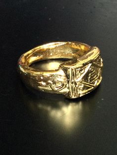 This is a perfect and unique style magic sacred ring made of metal gold plated by LP Kuay from Kositaram Temple. The power of the ring is to protect all dangers including ghost, evils and devils and the ring can bring good luck, fortune to the wearer. The ring showcases an elegant design with unique holy amulet. It is great to get this ring for your loved one or treat yourself for a classic timeless style. Amulet Name: LP Kuay Ring (1th Generation) Ring details: The ring engrave the Mantra of LP Symbolic Gold-plated Rings, Symbolic Gold Plated Gold Rings, Antique Gold Symbolic Engraved Jewelry, Symbolic Engraved Antique Gold Jewelry, Symbolic Yellow Gold Metal Jewelry, Symbolic Yellow Gold Jewelry, Collectible Gold-tone Brass Jewelry, Symbolic Bronze Metal Ring Jewelry, Symbolic Bronze Jewelry With Metal Ring