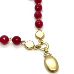 Red Jade with Matte Gold Accents and Pendant Necklace Measures 16" With a 2.5" Extender Finish Matte 18KT Gold Plated Made In the USA Style Number: DN157 Elegant Red Beaded Necklace With Lobster Clasp, Elegant Red Faceted Necklace, Elegant Red Single Strand Necklace, Red Necklace With Adjustable Chain, Red Faceted Round Necklaces, Red Faceted Round Necklace, Gold Ruby Single Strand Jewelry, Faceted Oval Red Jewelry, Red Faceted Oval Jewelry