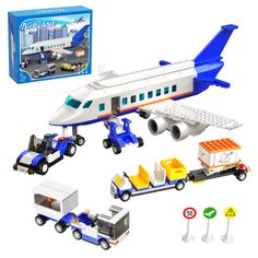 a toy airplane and some vehicles on a white background